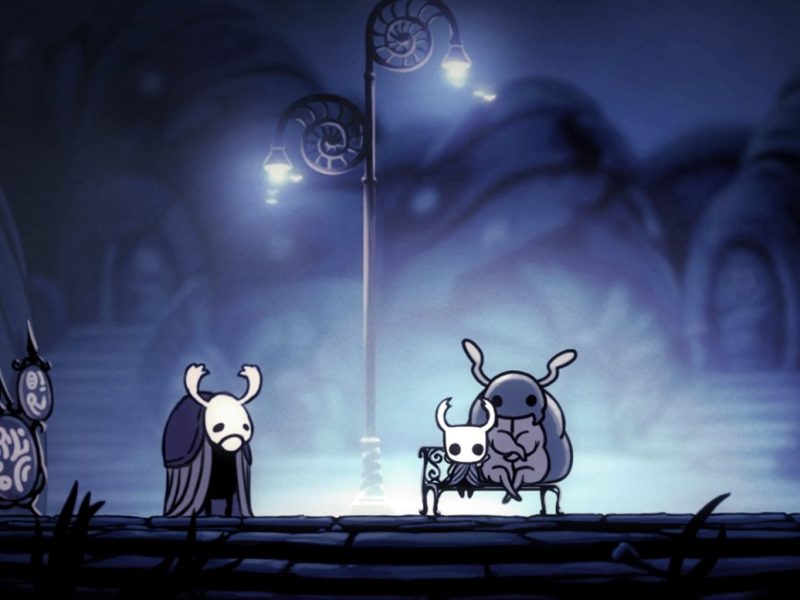 Ein Screenshot aus dem Spiel Hollow Knight, der Insekten-Charaktere unter einer Straßenlaterne zeigt
