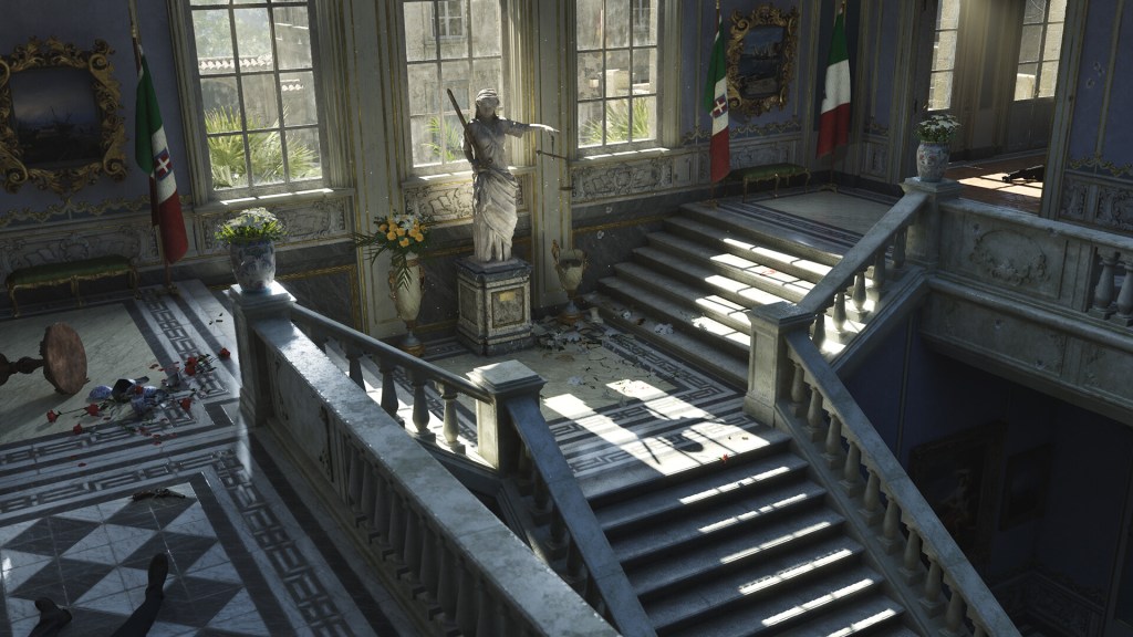 Screenshot aus Mafia: The Old Country. Zu sehen ist das Innere einer Villa mit einer großen Treppe und einer mächtigen Marmor-Statue.