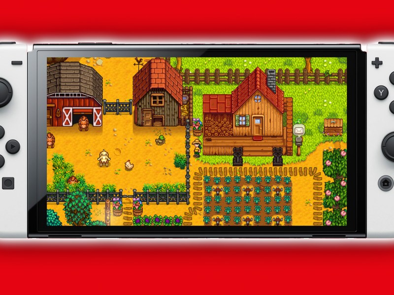 Eine Nintendo Switch mit Stardew Valley drauf und rotem Hintergrund.